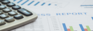 Photo of a calculator on top of a a report